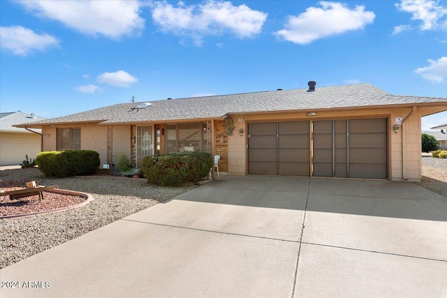 ranch-style house featuring a garage