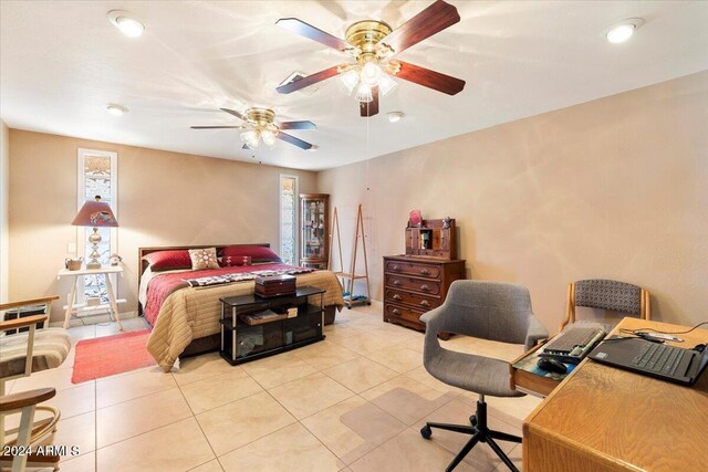 bedroom with ceiling fan and light tile patterned floors