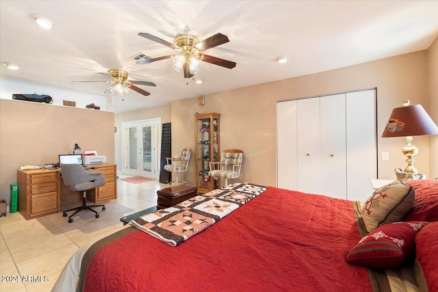 bedroom featuring light tile patterned flooring, ceiling fan, a closet, and french doors