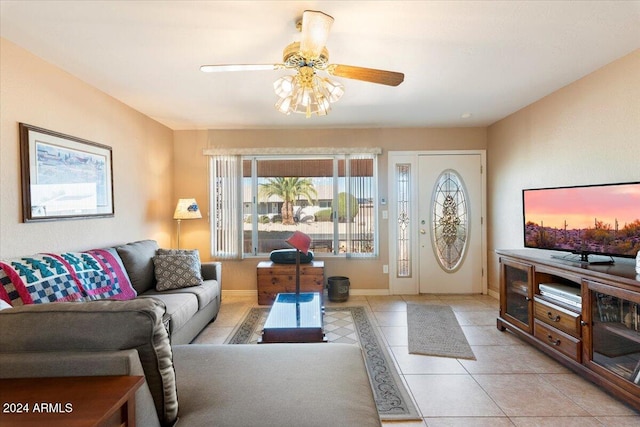 tiled living room featuring ceiling fan