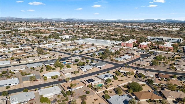 birds eye view of property featuring a mountain view