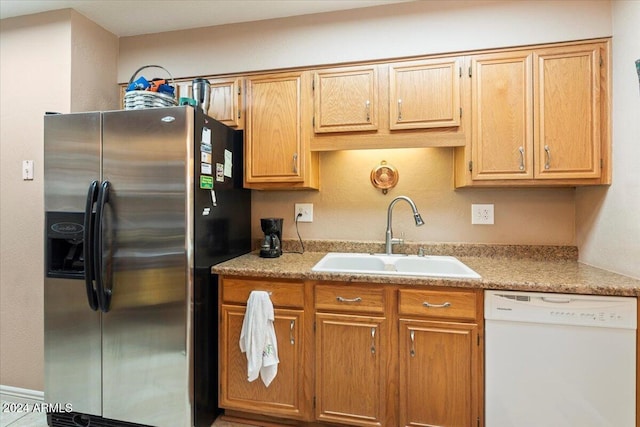 kitchen with stainless steel fridge, sink, and dishwasher