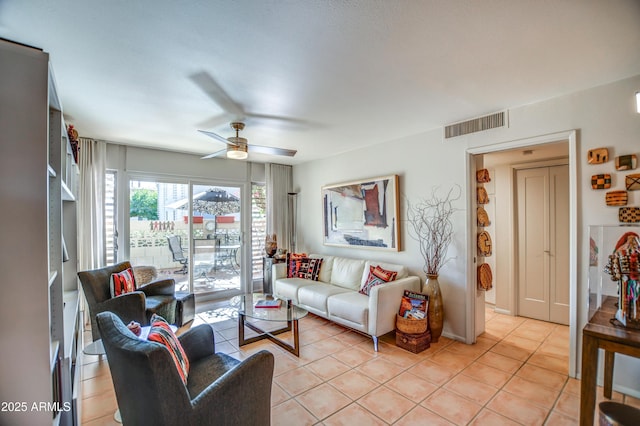 tiled living room featuring ceiling fan