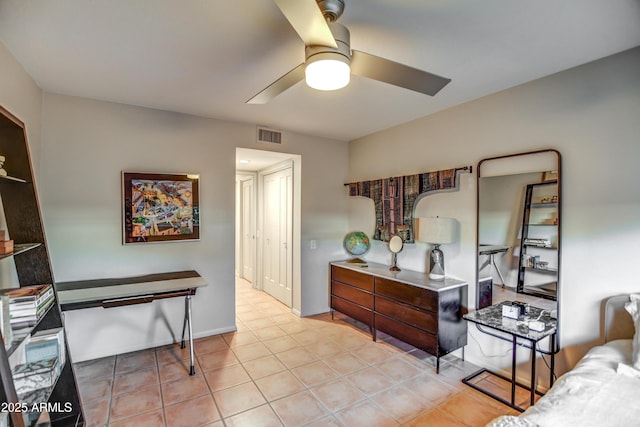 bedroom featuring light tile patterned flooring and ceiling fan