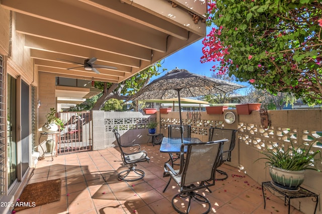 view of patio featuring ceiling fan