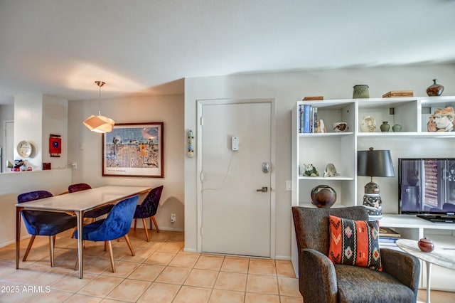 dining area featuring light tile patterned floors