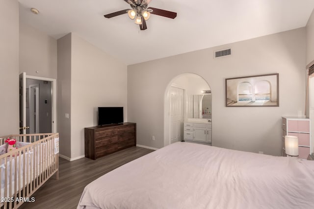 7826 W Mcrae Way, Glendale, AZ 85308 - bedroom featuring wood finished floors, baseboards, high vaulted ceiling, arched walkways, and ensuite bathroom
