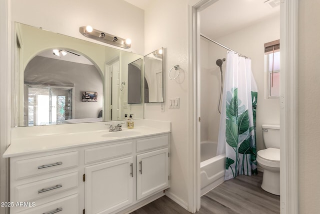 7826 W Mcrae Way, Glendale, AZ 85308 - bathroom featuring wood finished floors, toilet, vanity, and shower / tub combo