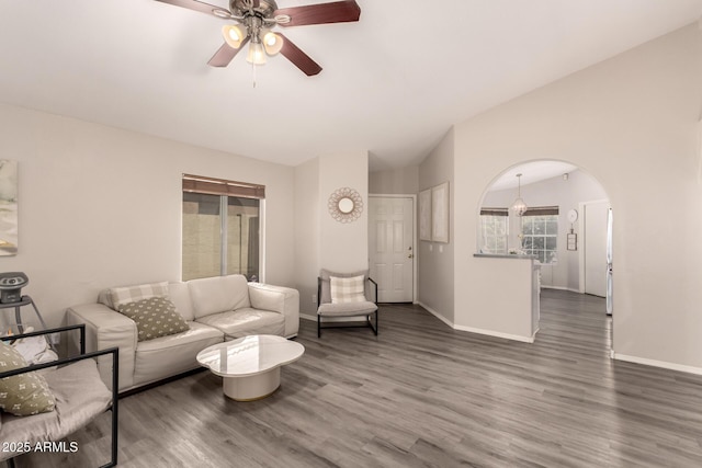 7826 W Mcrae Way, Glendale, AZ 85308 - living room with lofted ceiling, wood finished floors, a ceiling fan, baseboards, and arched walkways