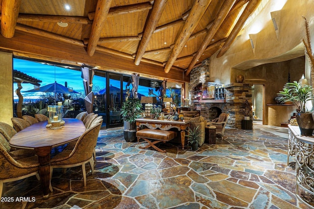 interior space with vaulted ceiling with beams and wood ceiling