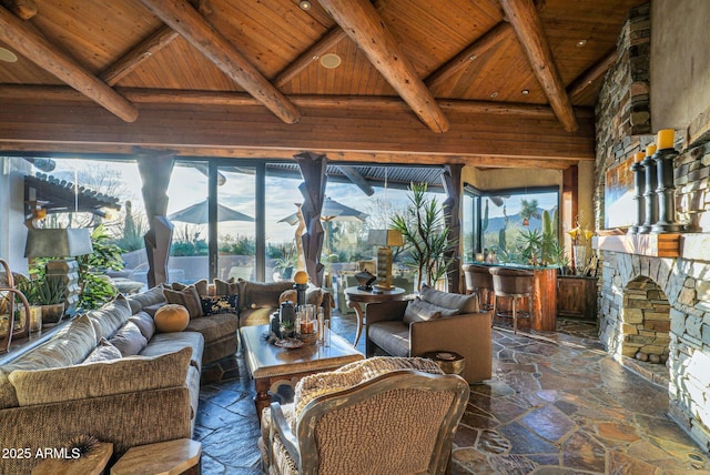 sunroom / solarium featuring a fireplace, wooden ceiling, and lofted ceiling with beams