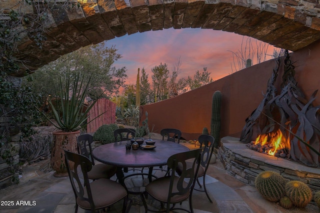 view of patio terrace at dusk