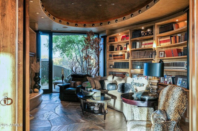 sitting room featuring a raised ceiling