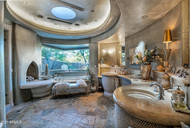 bathroom with sink and a tub