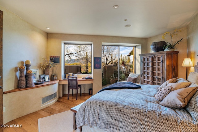 bedroom featuring wood-type flooring