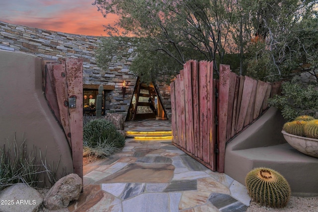 view of patio terrace at dusk