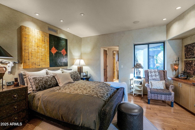 bedroom with light wood-type flooring