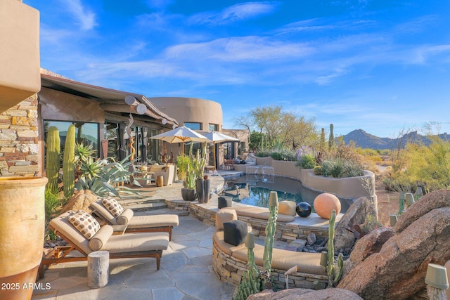 view of patio featuring a mountain view