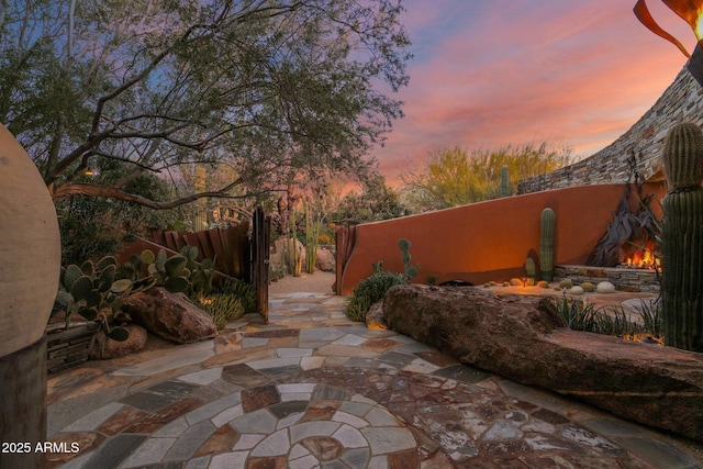 view of patio terrace at dusk