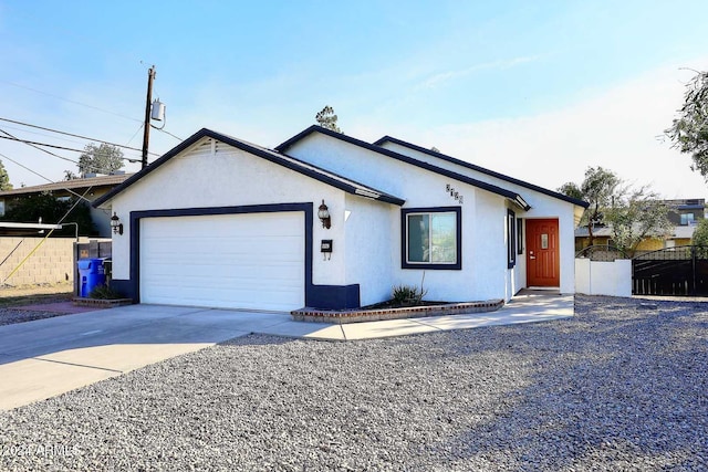 ranch-style house featuring a garage