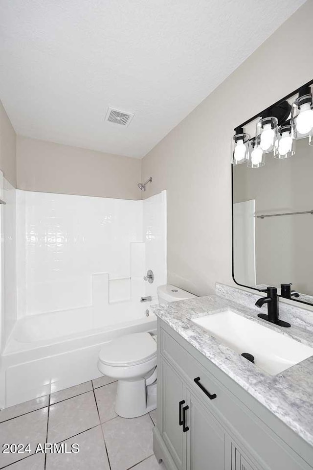 full bathroom featuring tile patterned flooring, vanity, toilet, and bathtub / shower combination