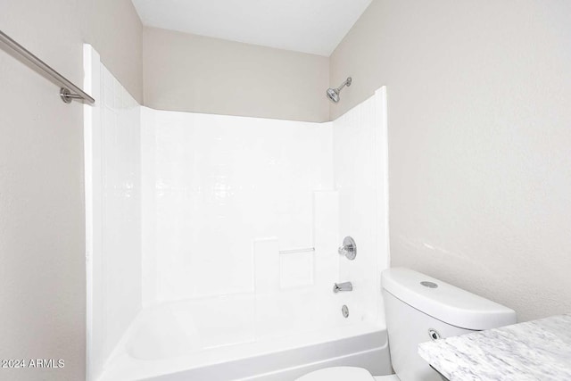 bathroom with toilet and shower / bath combination