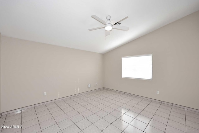 tiled empty room with ceiling fan and lofted ceiling