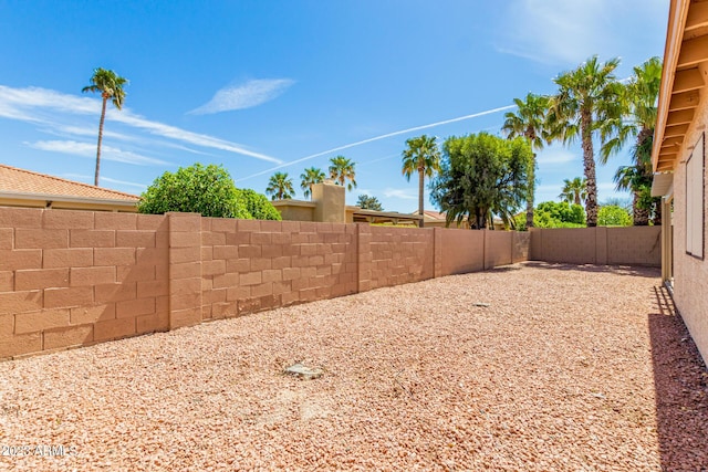 view of yard with a fenced backyard