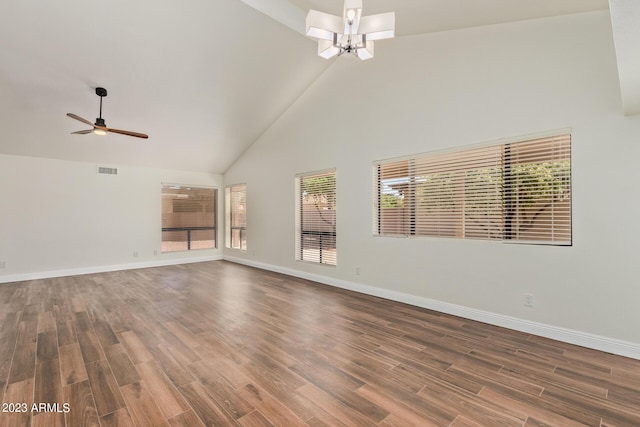 unfurnished living room with visible vents, high vaulted ceiling, wood finished floors, and baseboards