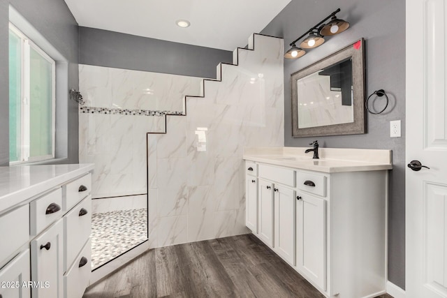 5321 N 196th Ave, Litchfield Park, AZ 85340 - bathroom featuring vanity, walk in shower, and wood finished floors