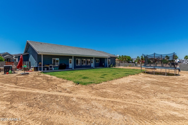 5321 N 196th Ave, Litchfield Park, AZ 85340 - rear view of house with a trampoline and a patio area