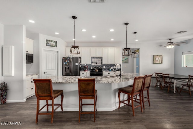 5321 N 196th Ave, Litchfield Park, AZ 85340 - kitchen featuring appliances with stainless steel finishes, a sink, backsplash, recessed lighting, and white cabinets