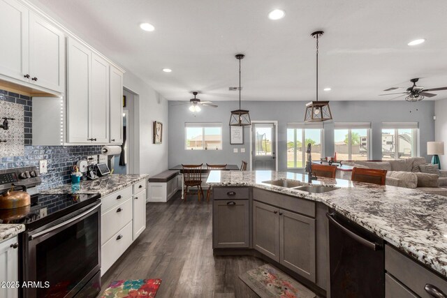 5321 N 196th Ave, Litchfield Park, AZ 85340 - kitchen with electric stove, a sink, dishwasher, ceiling fan, and tasteful backsplash