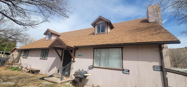 11150 E Clatterbuck Dr, Cornville, AZ 86325 - back of property with roof with shingles and a chimney