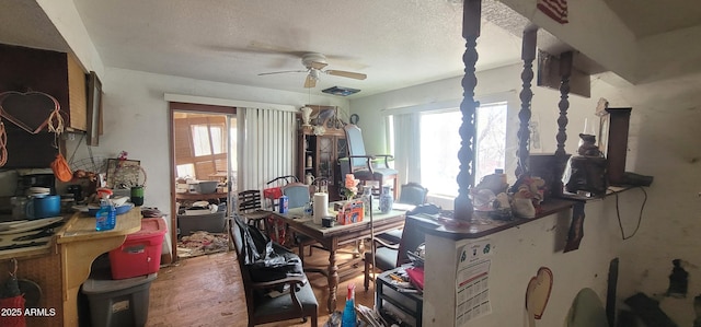 11150 E Clatterbuck Dr, Cornville, AZ 86325 - office space featuring ceiling fan, healthy amount of natural light, a textured ceiling, and wood finished floors