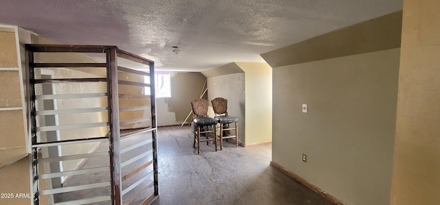 11150 E Clatterbuck Dr, Cornville, AZ 86325 - additional living space with a textured ceiling, lofted ceiling, baseboards, and wood finished floors