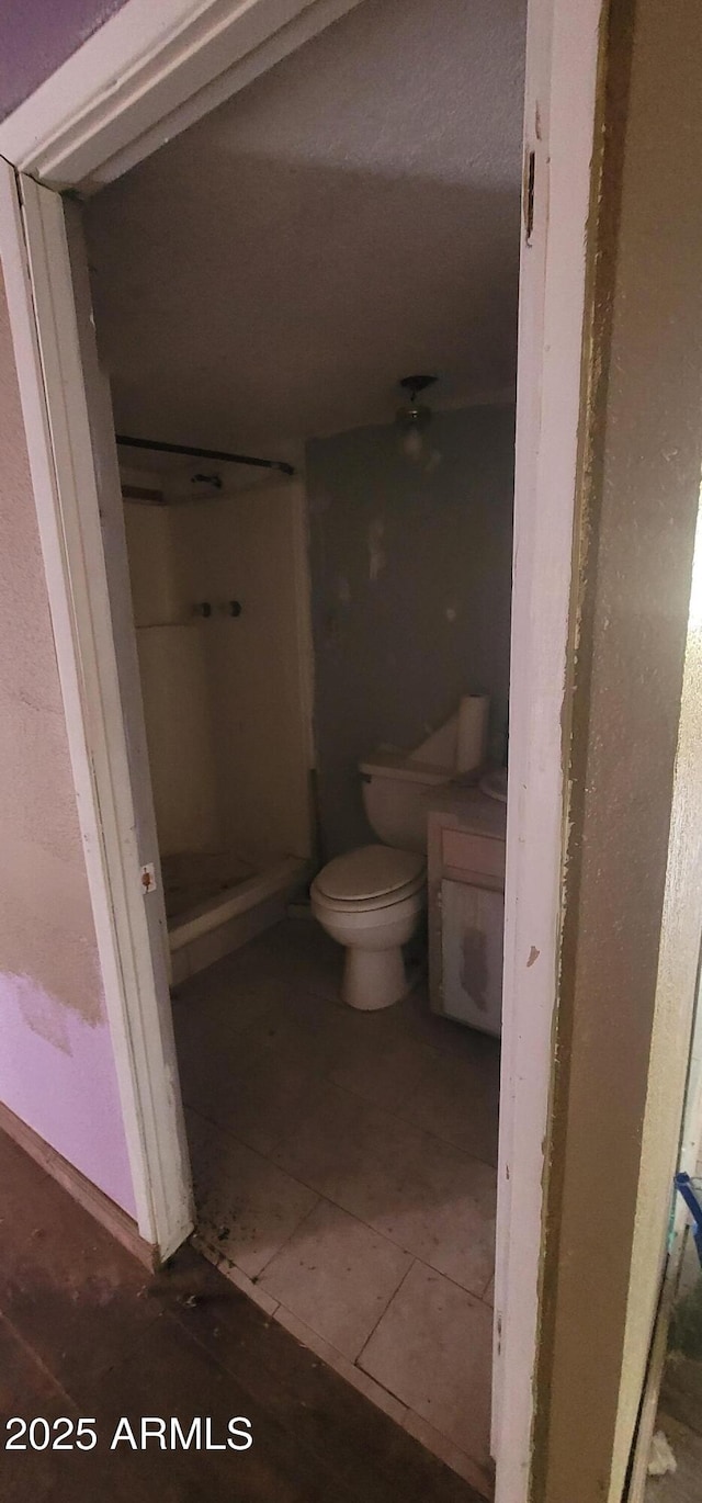 11150 E Clatterbuck Dr, Cornville, AZ 86325 - full bath featuring toilet, a shower stall, vanity, and tile patterned flooring