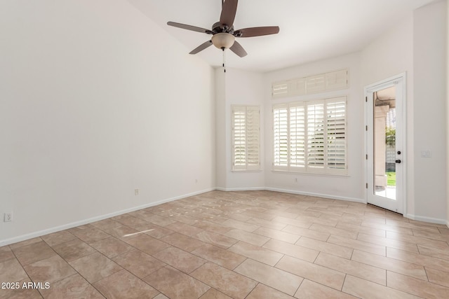 spare room with ceiling fan and a healthy amount of sunlight