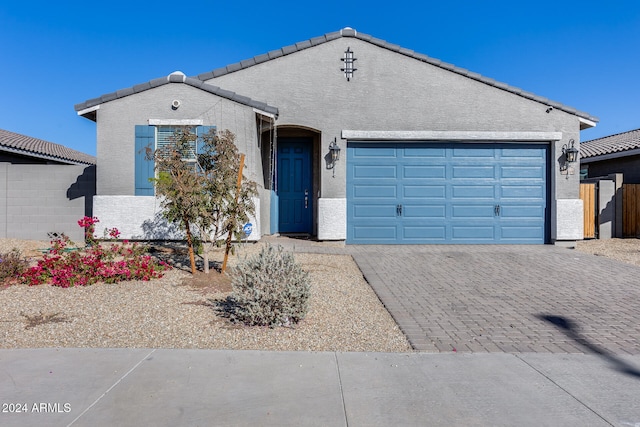 ranch-style house featuring a garage