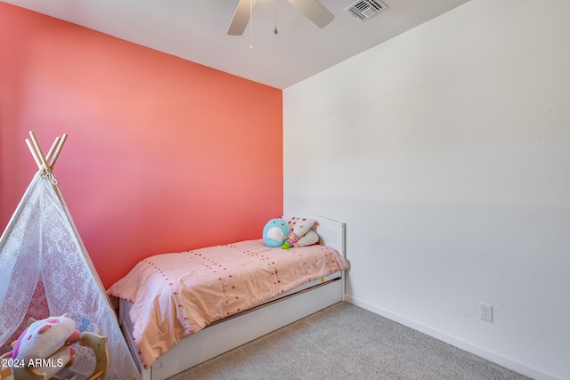 bedroom with ceiling fan and carpet