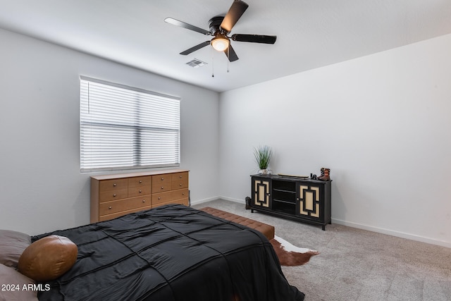 bedroom with light carpet and ceiling fan