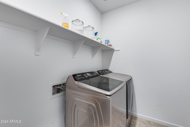 clothes washing area featuring washing machine and dryer