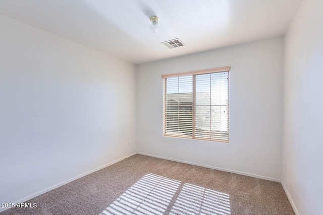 empty room with carpet flooring