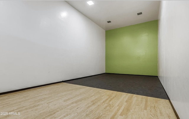 empty room with wood finished floors