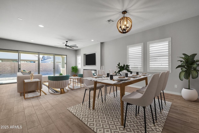 dining area with an inviting chandelier