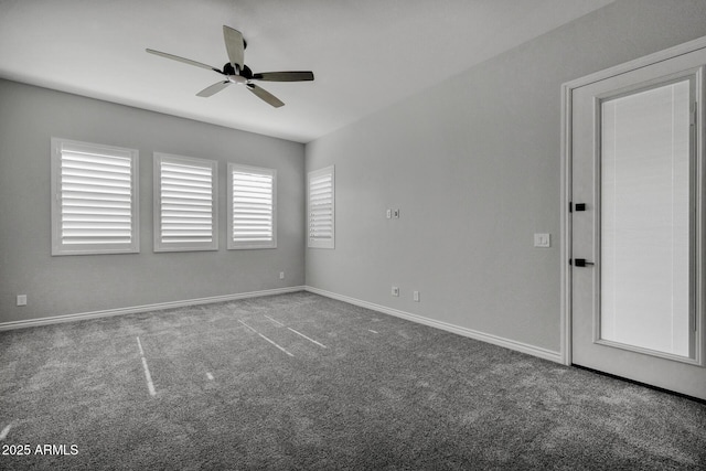 empty room with ceiling fan and carpet