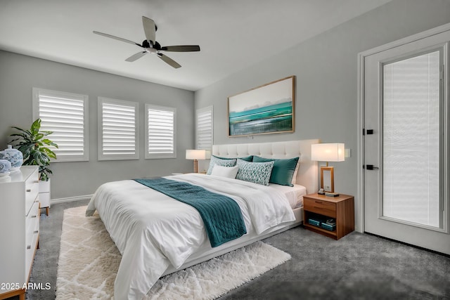 bedroom featuring ceiling fan and carpet