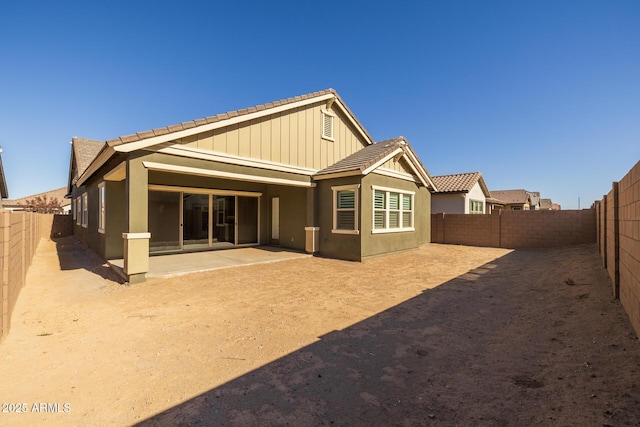 back of house with a patio area