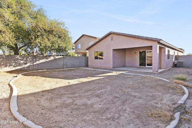 back of house with a patio and central air condition unit