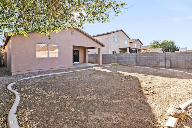 back of property with a patio area